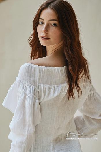 Elegant white linen blouse with ruffles perfect for Granada nights.