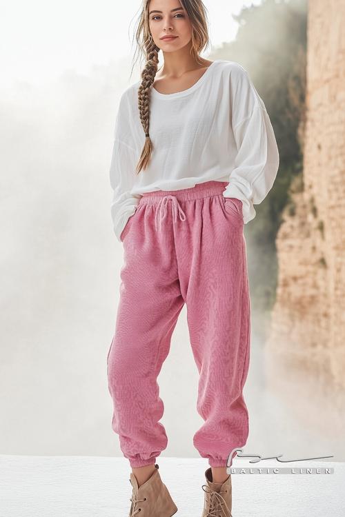 Stunning pink linen sweatpants styled in a misty outdoor setting