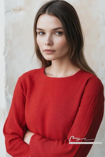 Elegant portrait at Carcassonne Castle showcasing red linen fashion.