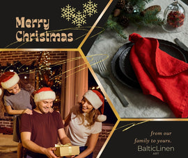 A cheerful family photo paired with merry Christmas wishes from the Baltic Linen family to yours