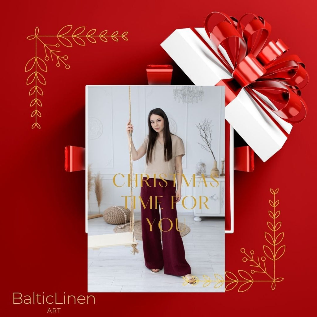 On a red background, a woman wearing a Baltic Linen linen suit—pants and blouse—invites you to dress elegantly during the Christmas season.