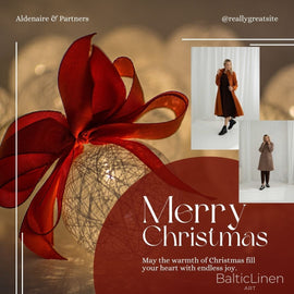 A Christmas ornament decorated with a red ribbon, alongside a woman styled in Baltic Linen wool coats, wishing you a beautiful Christmas and endless joy