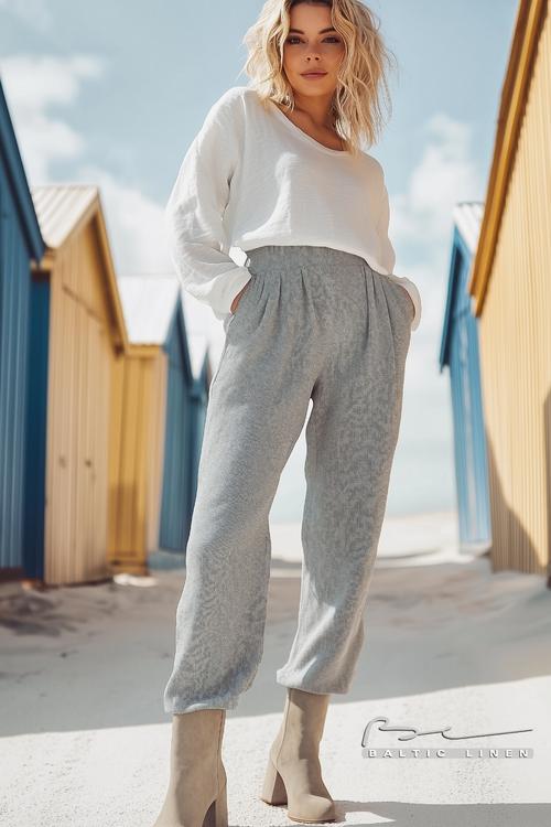 Stunning beach huts with grey linen trousers in the Scottish Highlands