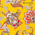 Decorative fabric pattern with floral designs on a yellow background