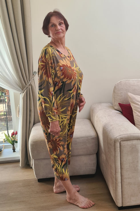 Comfortable and soft geriatric pyjama for seniors, modeled by an elderly woman, perfect for easy movement and relaxation.