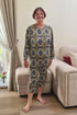 Elderly woman wearing a patterned geriatric pyjama designed for seniors, featuring soft fabric and easy-to-wear comfort.