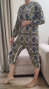 lady wearing bright and cozy geriatric pajamas for seniors, ideal for home, care, or hospital settings.